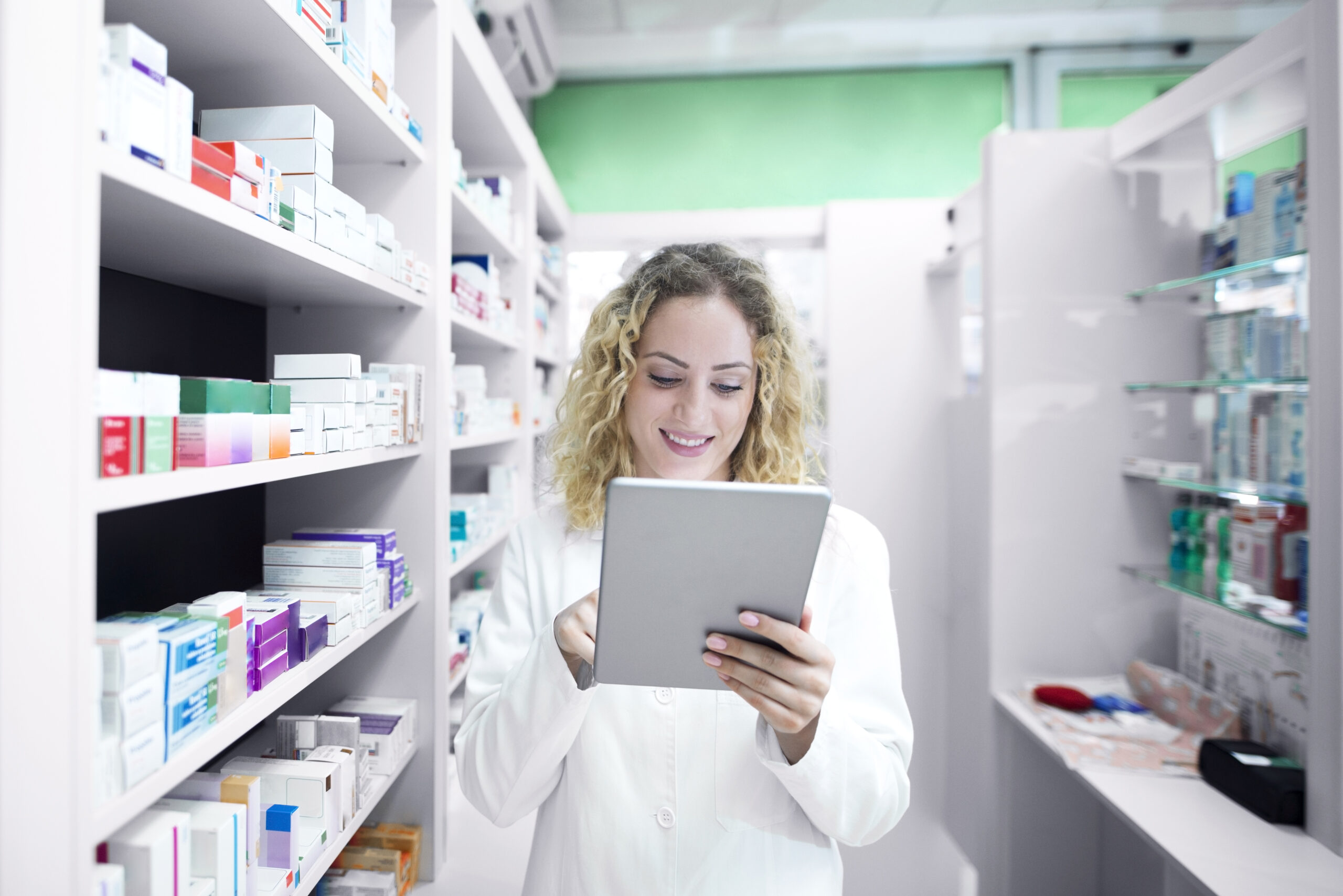 Female pharmacist working in drug store.